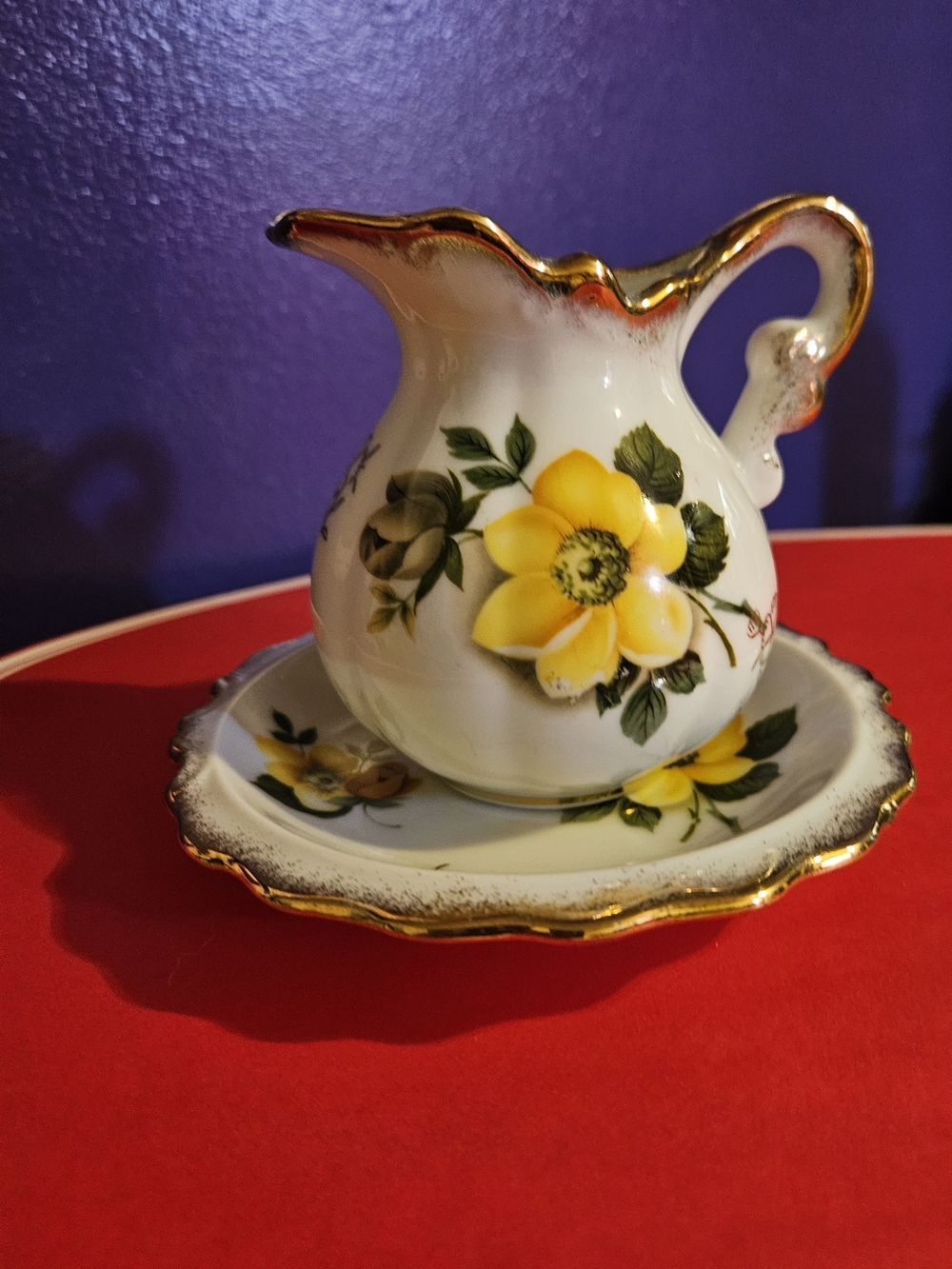 Yellow Floral Porcelain Creamer and Saucer with Gold Trim